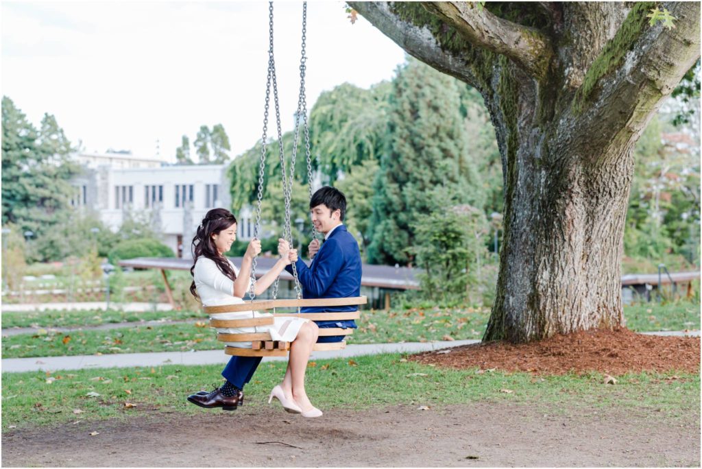 UBC Engagement Photos, couple on a swing under big tree