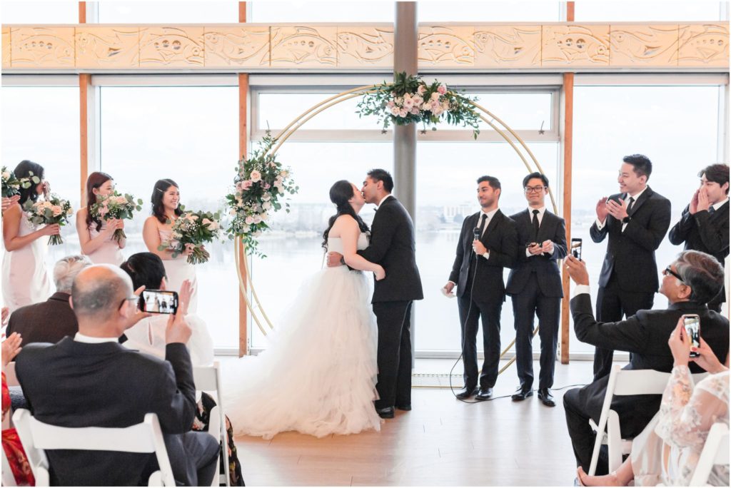 Elegant UBC Boathouse Winter Wedding Ceremony First Kiss