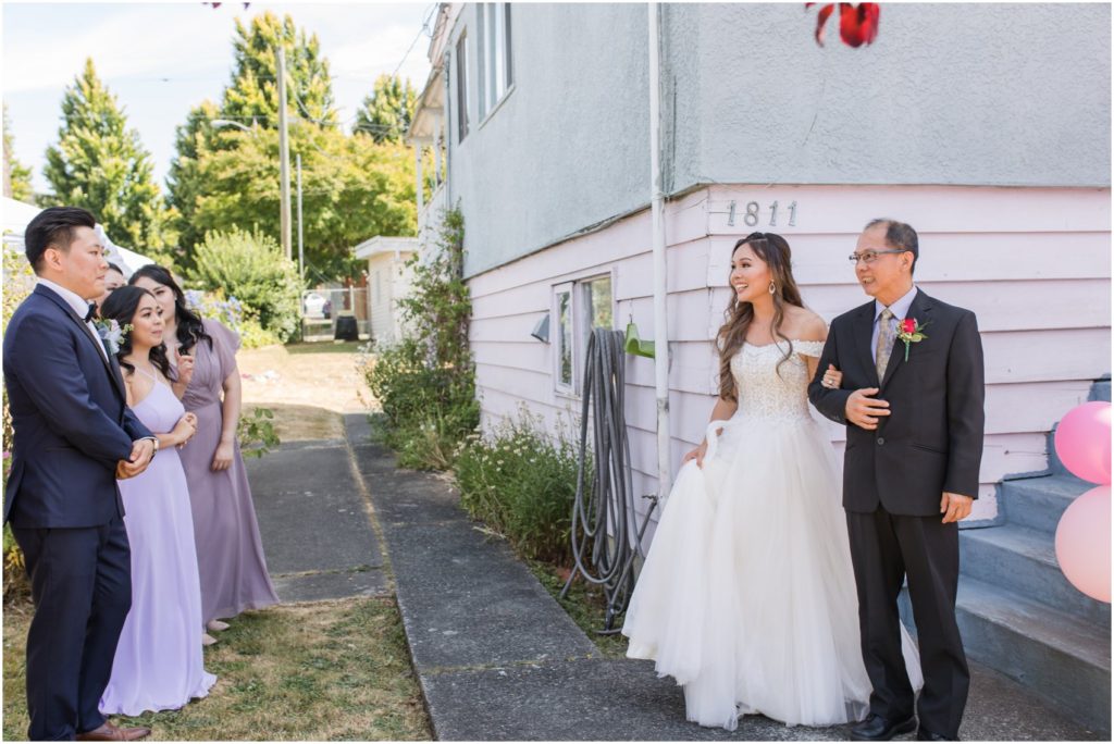 Father giving away bride to her groom