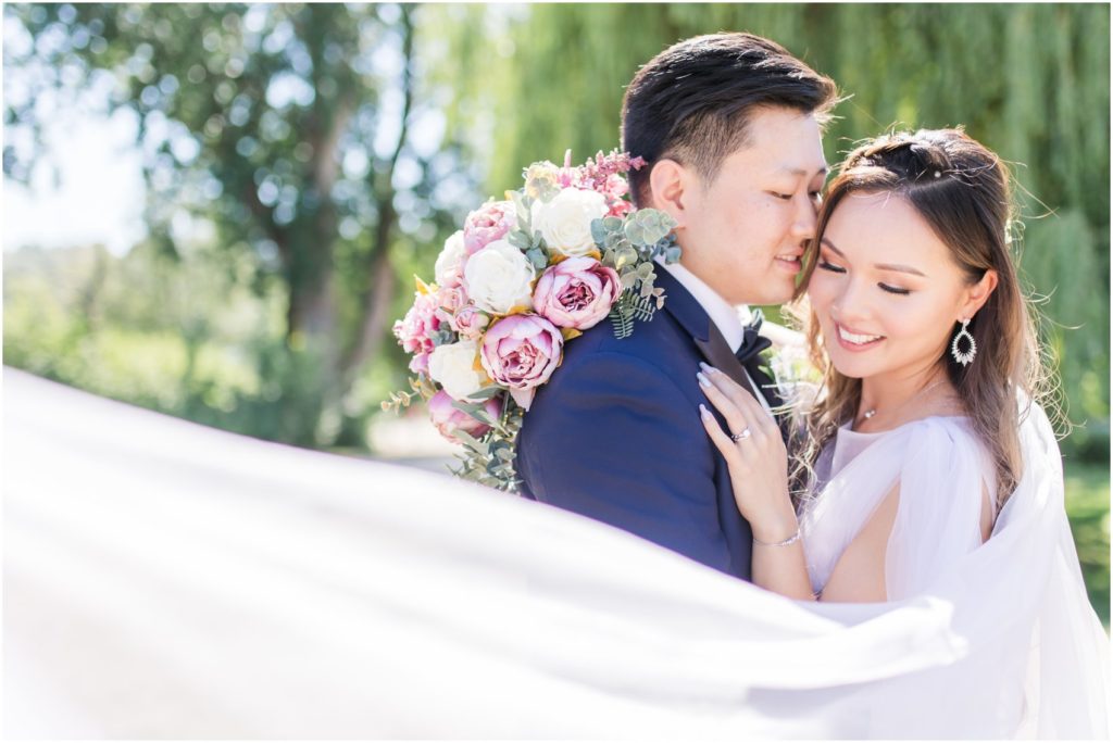 Joyful Bride and Groom with flying veil, Vivian Ng Photography, Vancouver Wedding Photographer