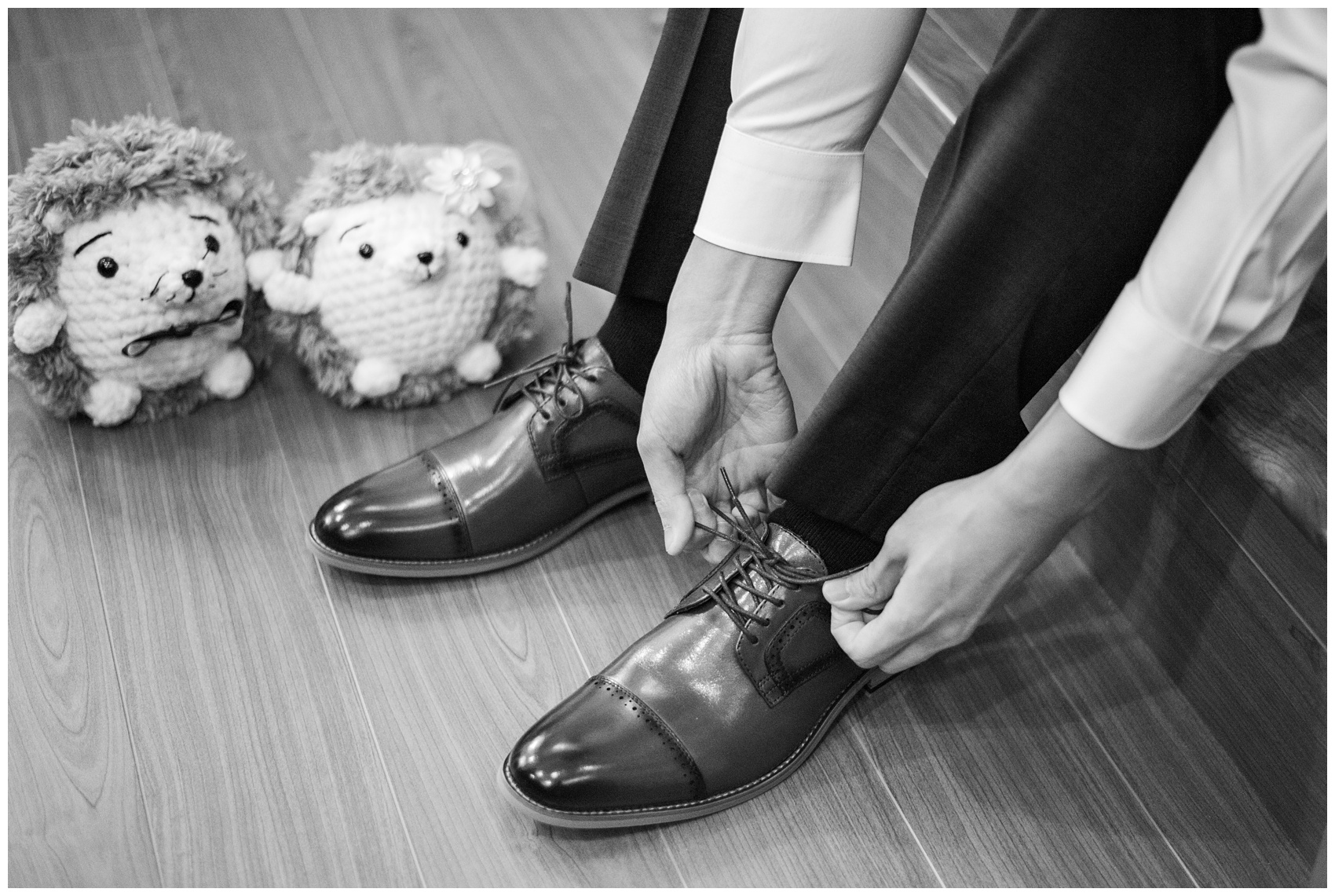 Coquitlam wedding groom putting on his shoes
