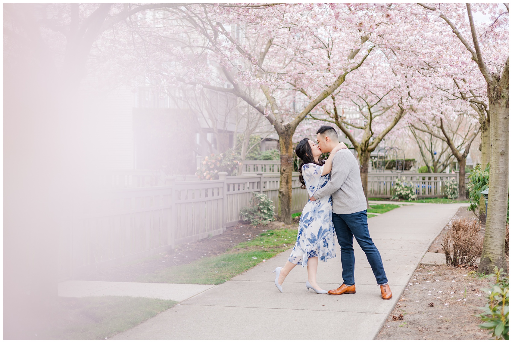 Engagement Session of couple kissing under the cherry blossom trees in Richmond, BC